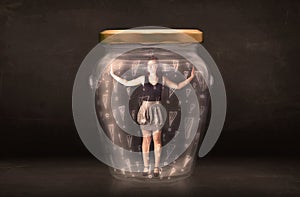 Business woman trapped in jar with exclamation marks concept