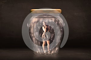 Business woman trapped in jar with exclamation marks concept