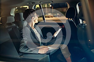 Business woman traveling with car by night on business trip