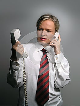 Business woman in trouble with phones