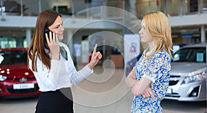 Business woman trying to calm down dissatisfied customer woman