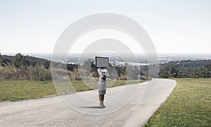 Business woman with TV instead of head.