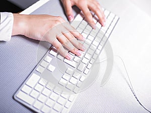 Business Woman Typing on Computer Keyboard