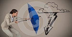 Business woman with umbrella blocking storm graphic against brown background
