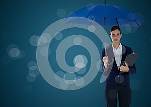 Business woman with umbrella and clipboard against blue background and bokeh