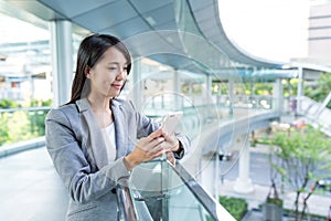 Business woman use of smart phone in financial district