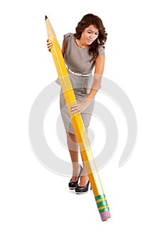 Business woman using a big pencil to erase a mistake.