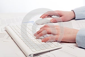 Business woman using computer mouse and keyboard