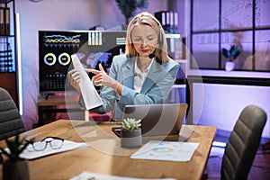Business woman using headset and laptop for video call