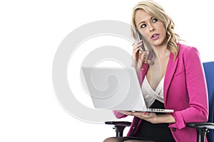 Business Woman Using a Laptop Computer and Mobile Cell Phone