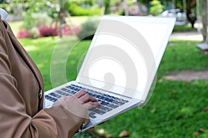 Business woman using laptop computer.works online on laptop which hand on keyboard.