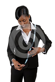 Business woman using measuring tape
