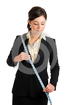 Business woman using a measuring tape