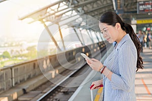 Business woman using the mobile smartphone