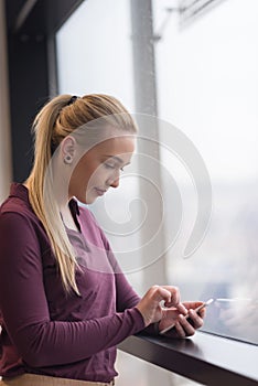 Business woman using smart phone at office