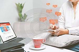 Business woman using smart phone with social network service or SNS, Social media concept. Woman using laptop computer and staying