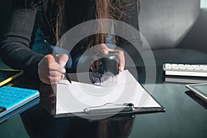 Business woman using stamp on document