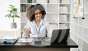 Business woman using tablet and laptop for doing math finance on an office desk, tax, report, accounting, statistics, and