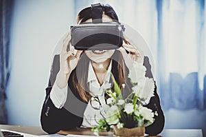 Business Woman using a VR headset for work with virtual reality, with fun and happy new experience, Concept of modern technologies