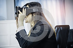 Business Woman using a VR headset for work with virtual reality, with fun and happy new experience, Concept of modern technologies