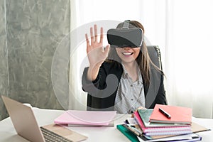 Business woman with vr glasses Touching something at the table i
