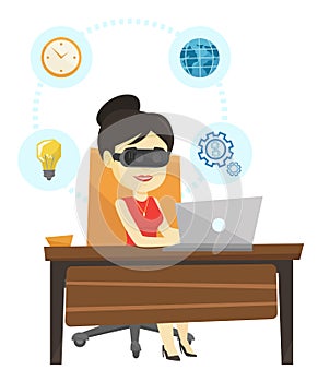 Business woman in vr headset working on computer.