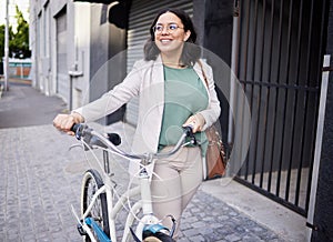 Business, woman and walking with bicycle in outdoor with smile for travel to work with marketer. Happy, business and