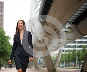 Business woman walking in the city