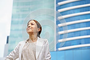 Business woman walking proud city office building