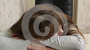 Business woman was weakened at work and fell asleep at a computer. close-up. tired office worker sleeps on documents at