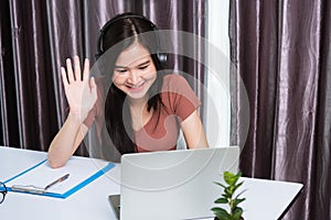 Business woman wearing headphones video call conference