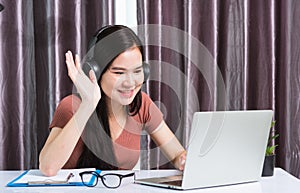 Business woman wearing headphones video call conference