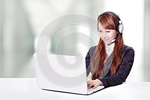 Business woman wearing headset with smile