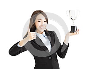 Business woman winning a trophy