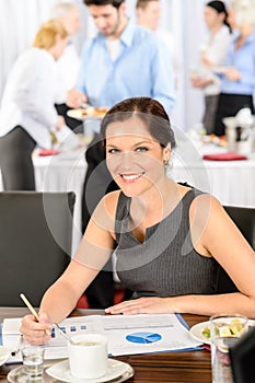 Business woman work during catering buffet