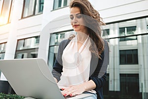 Business woman work during the lunch break use modern laptop and paper documents