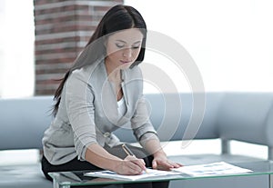 Business woman working with documents in the office