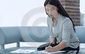 Business woman working with documents in the office