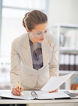 Business woman working with documents in office