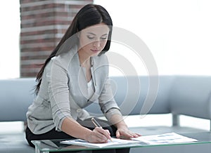 Business woman working with documents in the office