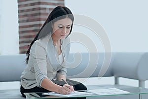 Business woman working with documents in the office