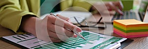 Business woman working with documents at the table in office closeup