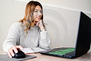 Business Woman working on her Laptop at Home