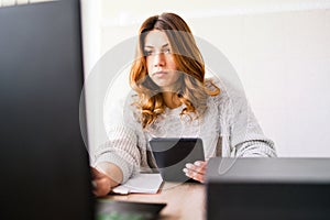 Business Woman working on her Laptop at office