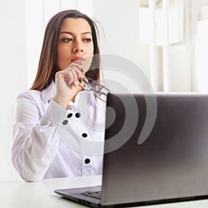 Business Woman working with a laptop (business, money, production, reporting, perspective, success)