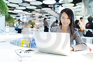 Business woman working on laptop computer in co-working place