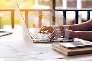 Business woman working on laptop computer in office