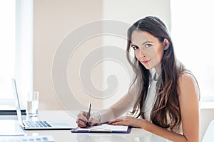 Business woman working in office with documents