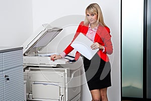 Business woman working on office printer