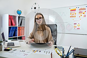 Business woman working at office with statistics and analytic research documents